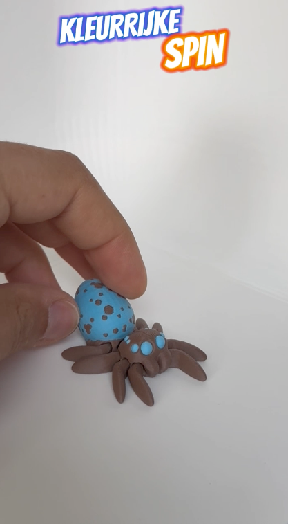 A demonstration video showing a playful, articulated brown and blue spider toy with movable legs.