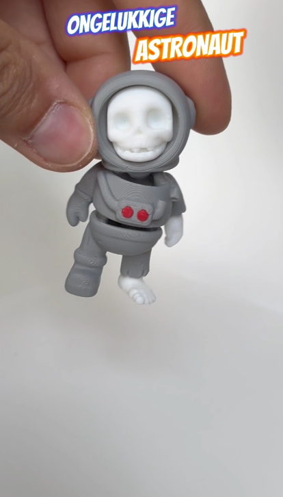 Video demonstration of a 3D-printed skeleton astronaut figure with movable parts and eerie space-themed design.
