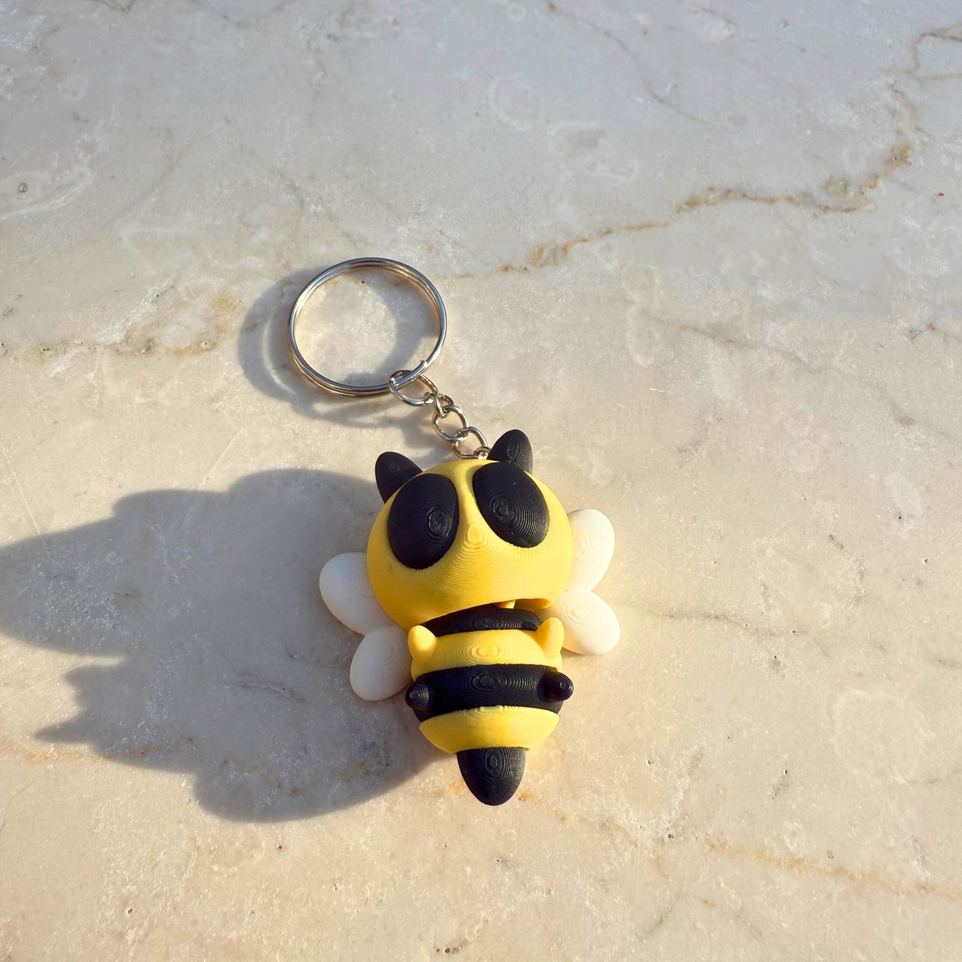 Geel-zwart gestreept 3D geprint flexibel bijtje speelgoed, met beweegbare vleugels, duurzaam PLA.