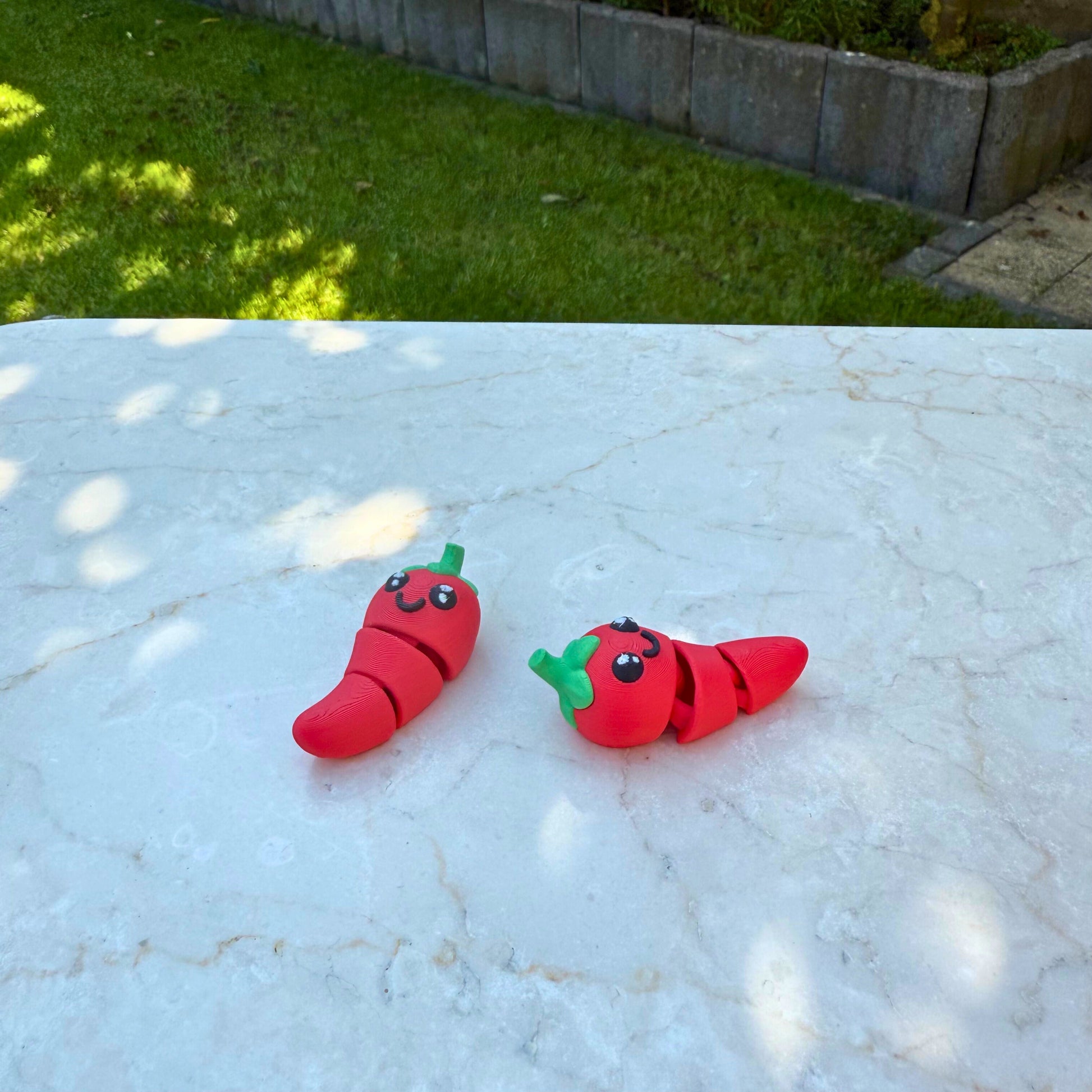 Duurzaam 3D geprint flexibel chilipeper speelgoed van WereldjeMakers, eco-vriendelijk en veilig.