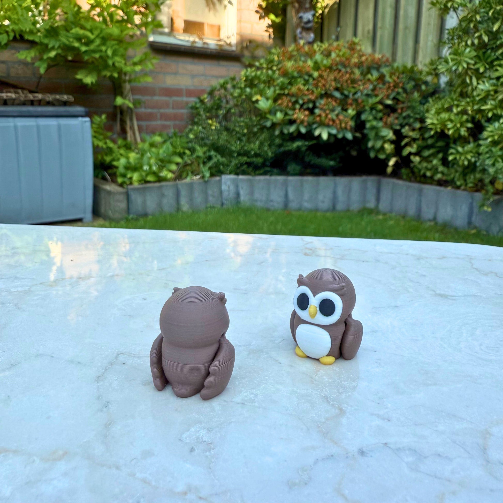 Detail van een 3D geprinte flexibele uil van WereldjeMakers, duurzaam en veilig speelgoed.